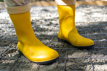 Worker with yellow boots