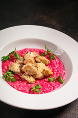 risotto chicken meat (red rice with beetroot flavor, delicious main course) menu concept. food background. copy space. Top view