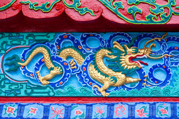 Dragon colorful bas-relief in a taoist temple in QingChengShan, Sichuan province, China