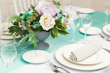 The served table with beautiful setting in restaurant