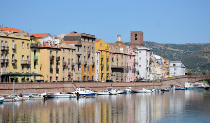 panoramic view of the ancient buildings of the city of Bosa along the "Temo" river on a sunny summer day