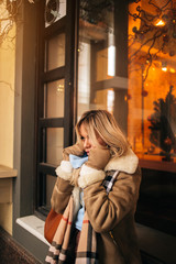 Beautiful blonde girl feeling cold