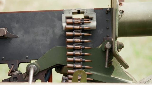 Maxim machine gun with a round of ammo, summer sunny day