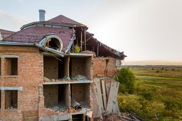Old ruined building after earthquake. A collapsed brick house .