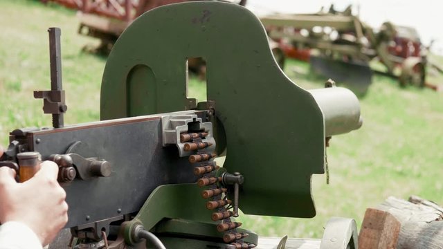 Maxim machine gun with a round of ammo, summer sunny day