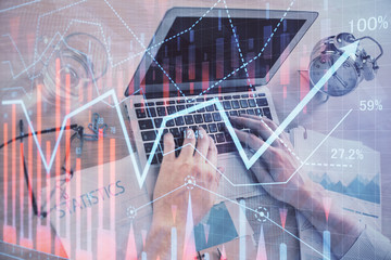 Multi exposure of forex graph with man working on computer on background. Concept of market analysis.