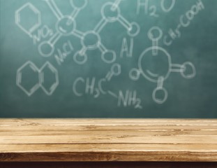 Molecule models and formulas on blackboard background