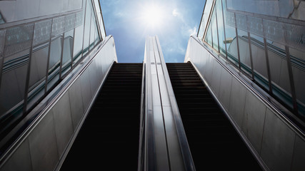 Couple escalator to the sky , abstract background of rising way to success