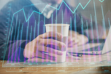 Forex graph with businessman working on computer in office on background. Concept of hardworking. Closeup. Multi exposure.