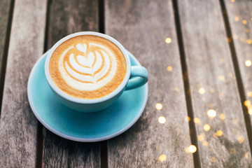 Fresh flavored coffee art on wooden background.