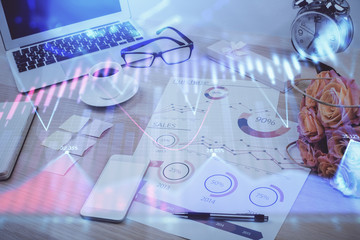 Forex market chart hologram and personal computer background. Double exposure. Concept of investment.