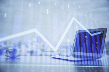 Forex graph hologram on table with computer background. Multi exposure. Concept of financial markets.