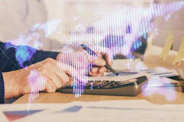 Double exposure of Man writing in notepad with business icons on background.