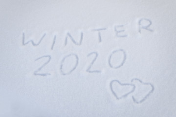 text winter 2020 two hearts on snow