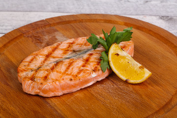 Grilled salmon served lemon and parsley