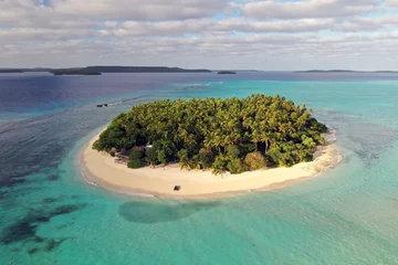 Fotobehang Aerial shot of a scenic landscape of desert island with white sand beach and crystal clear sea water bay.  © Kitreel