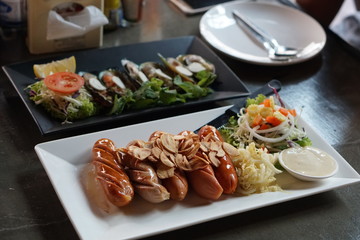 homemade sausages, sauces ketchup, grilled sausages with sauce G