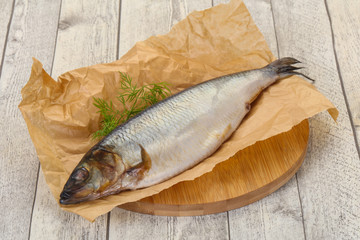 Salted herring over the wooden board