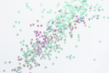 Pastel mint confetti stars on a white background. Holiday Party Concept