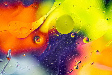 Abstract rainbow color backdrop with oil drops and waves on water surface. 3d render illustration