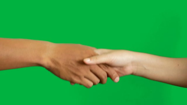 4K. man and woman in difference skin color shaking hands for business deal agreement isolated on chroma key green screen background