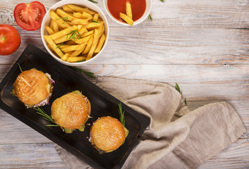 Top view classical burgers with french fries