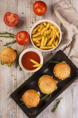 High angle beef burgers with delicious fries