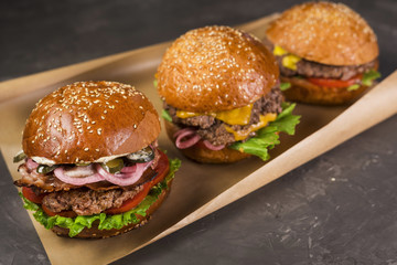 Set of delicious cheeseburgers with lettuce and tomatoes