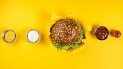 Top view classic burger with various dips
