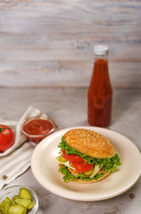 Tasty classic burger with cheese and ketchup