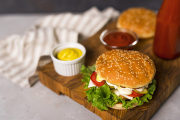 Close-up tasty burgers with mustard and ketchup