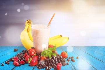 Healthy Fruit Smoothie in glass on wooden table Background