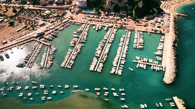 Aerial view of harbor with many yacht, motorboat and sailboat. Beautiful port