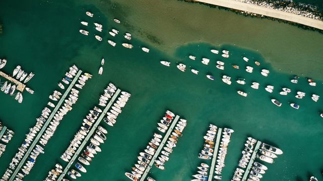 Aerial view of harbor with many yacht, motorboat and sailboat. Beautiful port