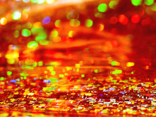 Bright red background. Shiny and sparkling holographic rainbow backdrop.