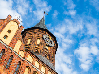 Cathedral of Koenigsberg. Clock tower on blue sky background. Kaliningrad, Russia.