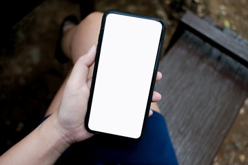Women's hands holding cell telephone watching social media in a smart phone. social network concept with smart phone