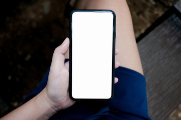 Women's hands holding cell telephone watching social media in a smart phone. social network concept with smart phone