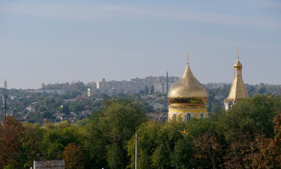 Fototapeta na wymiar Domes of the city s church in autumn. Kupyansk, Ukraine