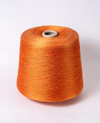 bobbin of yarn on a white background. Side view.Textile reel on isolated white background.