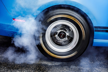 Drifting car. Drag racing car burns rubber off tires before the start © Rychko Yevhen