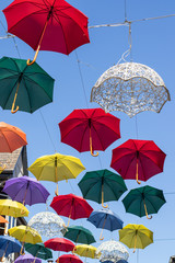 Obraz premium Umbrellas against blue sky 