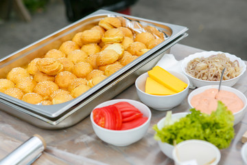 A set of ingredients for making the mini cheeseburgers
