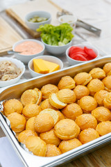 An upper view on the ingredients for mini cheeseburger making