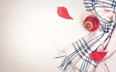 Autumn concept top view background,scarf and cup tea flat lay.