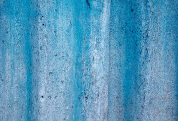 The wall is painted with blue paint as an abstract background
