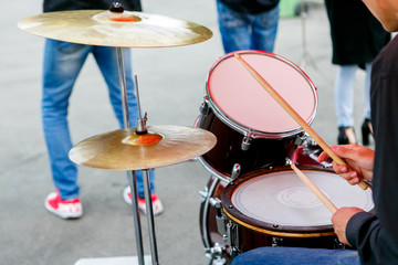A closeup plane of street orchestra drum set