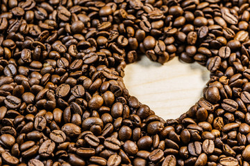 Roasted coffee beans with heart form