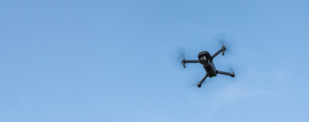 concept picture of modern technologies drone object for aerial photography on empty blue sky background with copy space for text 