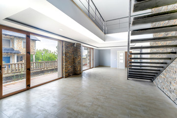 Empty and unfurnished brand new modern house. Beautiful big living room.